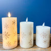 Golden Snowflake Pillar Candles - Three Sizes available at Quilted Cabin Home Decor.