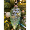 Decorative glass ornament shaped like a pine cone on a Christmas tree. Vintage Green Glass Ornaments - Three Styles available at Quilted Cabin Home Decor.