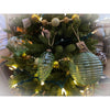 Decorative Christmas tree with ornaments and lights indoors. Vintage Green Glass Ornaments - Three Styles available at Quilted Cabin Home Decor.
