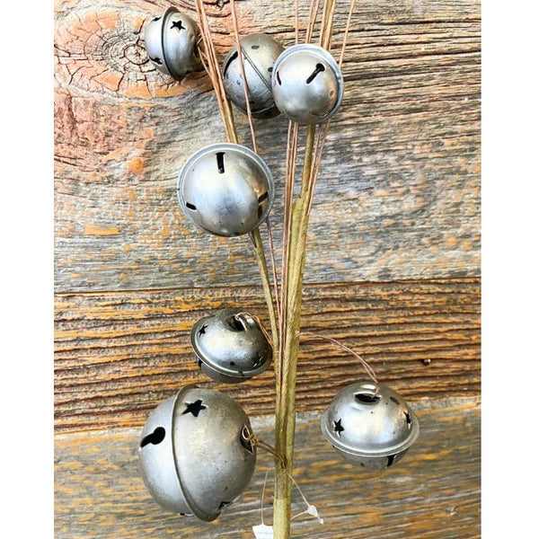 seven silver traditional style jingle bells attached to slim floral wires to add into floral displays or use in centerpieces. Available at Quilted Cabin Home Decor.