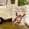 Sign with a donkey illustration and humorous text in front of a vintage truck. Complimentary Jackass Wood Block Sign available at  Quilted Cabin Home Decor.