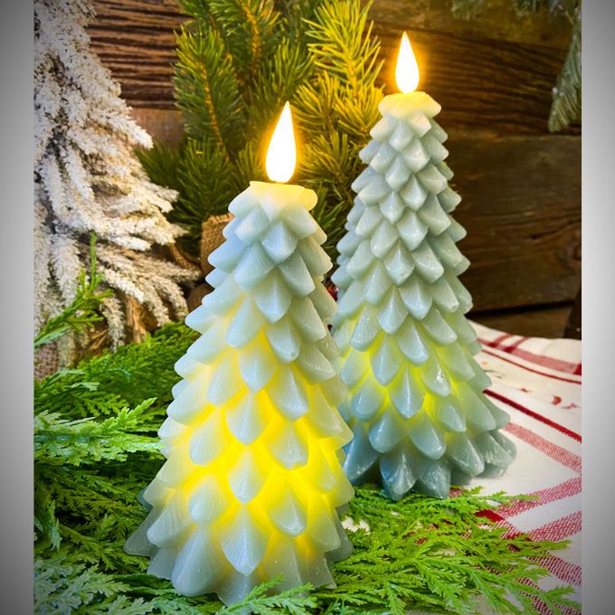 Two green christmas tree shaped candles available at Quilted Cabin Home Decor.