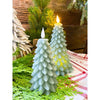 Two green christmas tree shaped candles available at Quilted Cabin Home Decor.