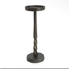 A rustic black metal candle holder with a twisted stem, featuring a circular top cup and a round base, shown against a plain white background.  Two sizes of candle holders available at Quilted Cabin in Airdrie