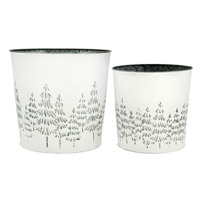 White Distressed Galvanized Tree Buckets - Two Sizes are shown. Two white metal buckets with embossed trees on the outside to fill with holiday florals. Available at Quilted Cabin Home Decor.