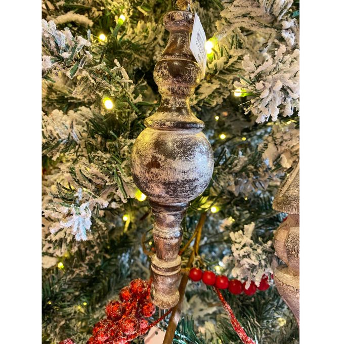 Decorative finial on a Christmas tree with lights and ornaments. Mango Wood Finial Ornaments  - Three Styles available at Quilted Cabin Home Decor.