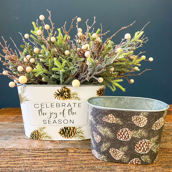 Woodland Pine Oval Buckets - Two Styles are metal. One is printed with white and pine cones and the smaller one is printed with black and pine cones. Available at Quilted Cabin Home Decor.