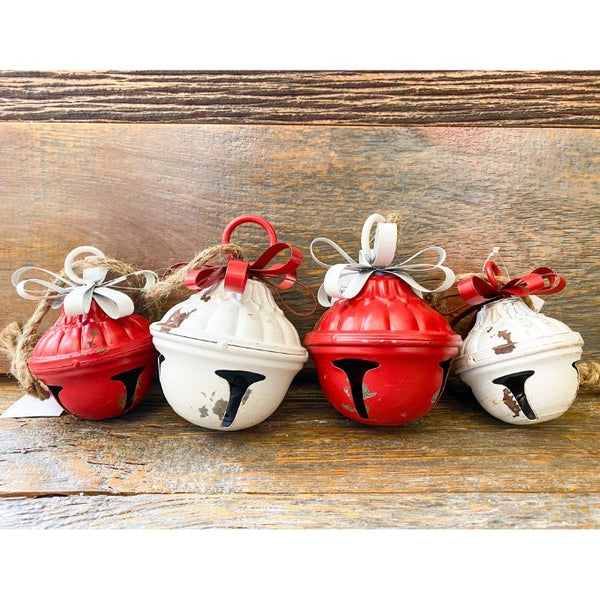 Nutshell shaped bells - two red and two white with contrasting metal bows. Available at Quilted Cabin Home Decor.