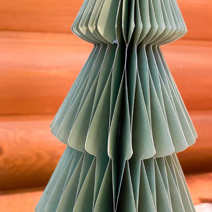 Green paper tree against an wooden background. Vintage Green Paper Trees - Two Sizes available at Quilted Cabin Home Decor.