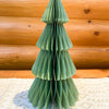 Green paper Christmas tree against a wooden background. Vintage Green Paper Trees - Two Sizes available at Quilted Cabin Home Decor.