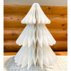 White paper Christmas tree on a wooden surface. Vintage White Paper Trees - Three Sizes available at Quilted Cabin Home Decor.