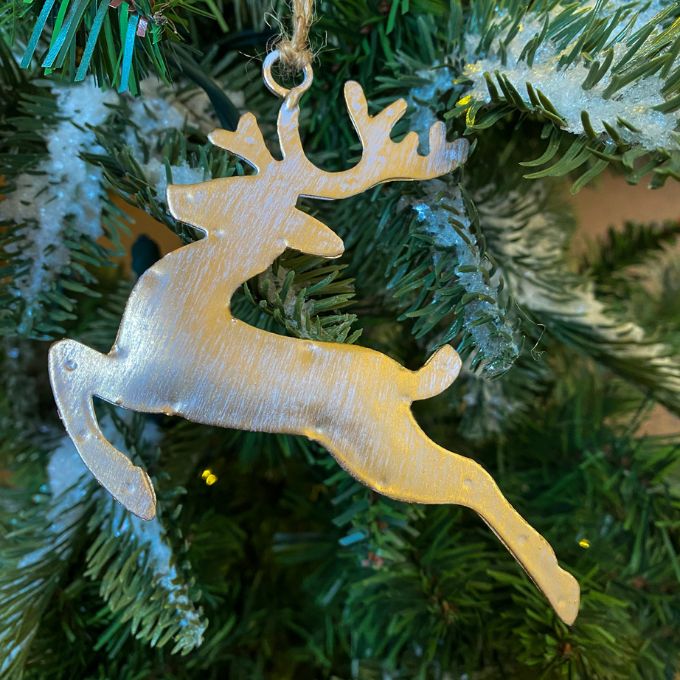 White washed gold deer ornaments in two styles - one is standing and one is flying. Available at Quilted Cabin Home Decor.