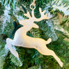 White washed gold deer ornaments in two styles - one is standing and one is flying. Available at Quilted Cabin Home Decor.