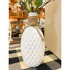 White textured vase with decorative rope and plant on a checkered table runner. Porcelain Textured Vase available at Quilted Cabin Home Decor.