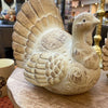 Decorative resin turkey decor on a wooden surface. Weathered Resin Turkey available at Quilted Cabin Home Decor.