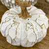 Decorative pumpkin with white on a wooden surface, the White Carved Pumpkins - Two Styles available at Quilted Cabin Home Decor.