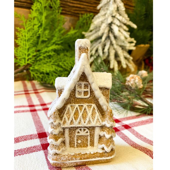 Two small gingerbread houses with lots of snow on the roof available at Quilted Cabin Home DEcor.