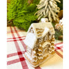 Two small gingerbread houses with lots of snow on the roof available at Quilted Cabin Home DEcor.