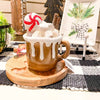 Hot Chocolate Cup Figurine that looks like it is overflowing with chocolate and marshmallows is available at Quilted Cabin Home Decor.