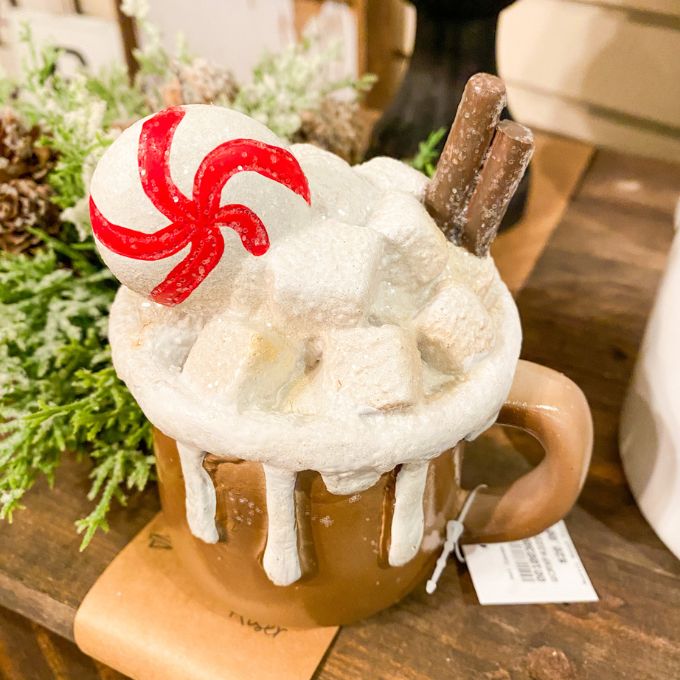 Hot Chocolate Cup Figurine that looks like it is overflowing with chocolate and marshmallows is available at Quilted Cabin Home Decor.