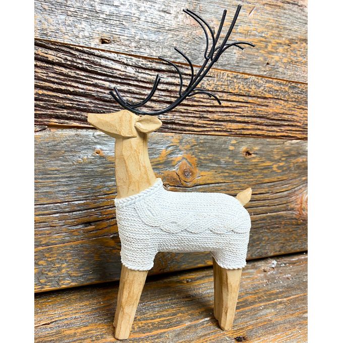 One resin standing deer figurine wearing a white cable knit sweaters is shown.  Available at Quilted Cabin Home Decor.