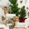 Two resin deer figurines with white cable knit sweaters are shown, one is sitting and one standing. Available at Quilted Cabin Home Decor.