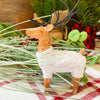 Small Sweater Deer Figurine in a stand of trees. The deer is wearing a cozy white cable knit sweater. Available at Quilted Cabin Home Decor.