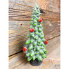 A green frosty evergreen tree figurine with red cardinals on it available at Quilted Cabin Home Decor.