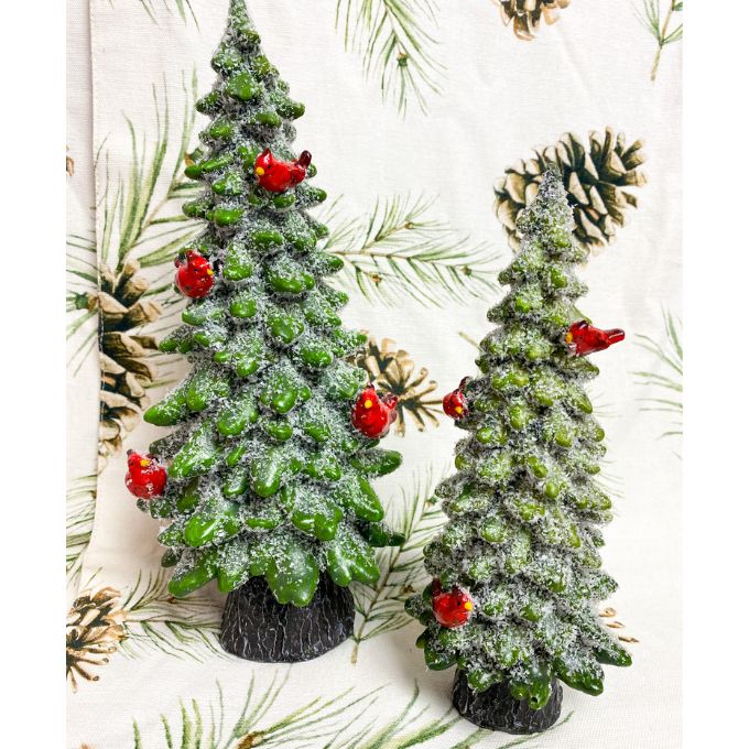 Christmas Tree with cardinal figurines are green resin evergreen style trees with frosty boughs and red cardinals. available at Quilted Cabin Home Decor. 