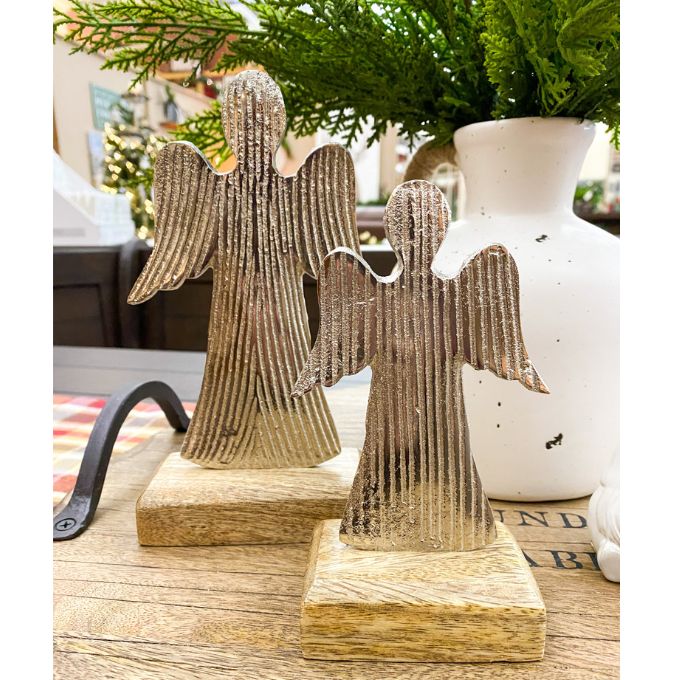 Decorative angel figures on wooden bases with a blurred indoor background. Midnight Shimmer Angels - Two Sizes available at Quilted Cabin Home Decor.