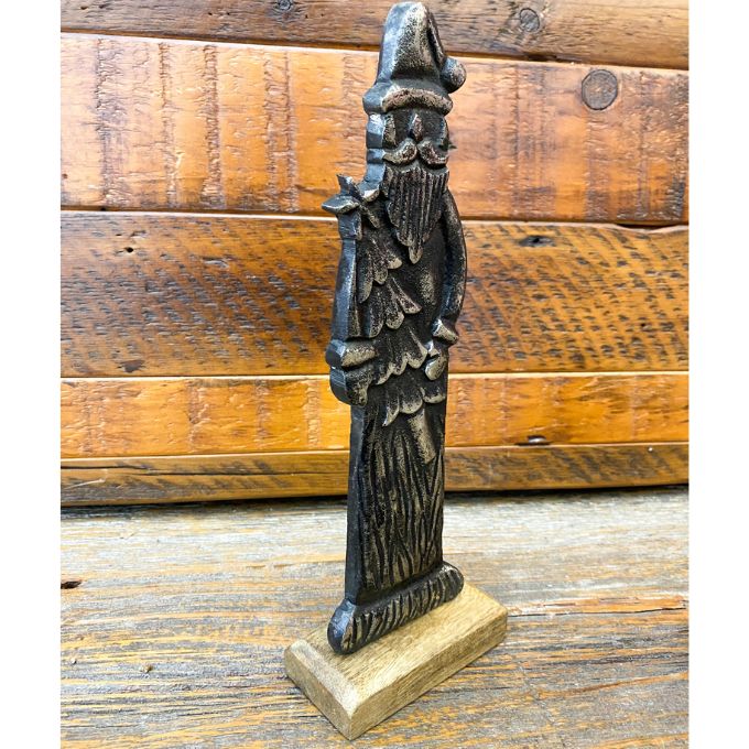 Decorative vintage santa clause figurine on a wooden background. Tarnished Santa Figurine available at Quilted Cabin Home Decor.