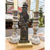 Decorative figure of vintage Santa Claus with two candle holders on a table. Tarnished Santa Figurine available at Quilted Cabin Home Decor.
