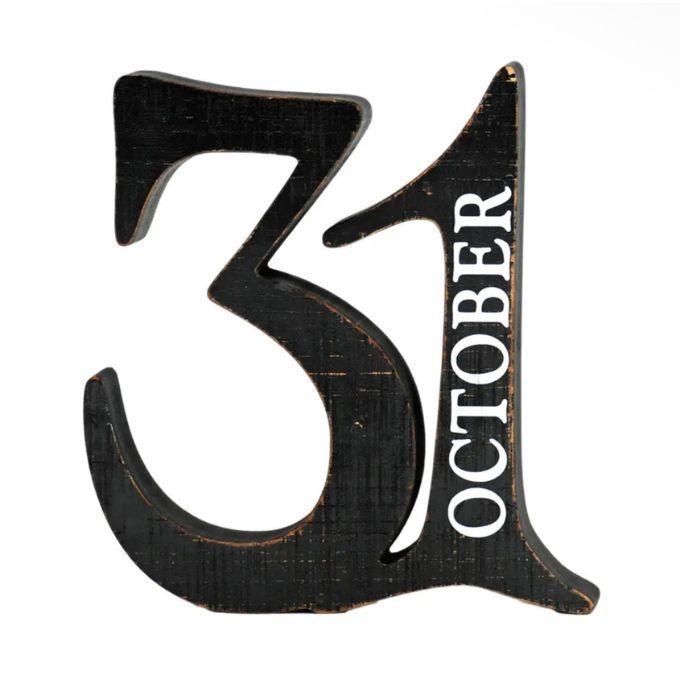 A rustic black wooden number 31 with the word 'OCTOBER' in white lettering, shown on a plain white background. Available at Quilted Cabin in Airdrie
