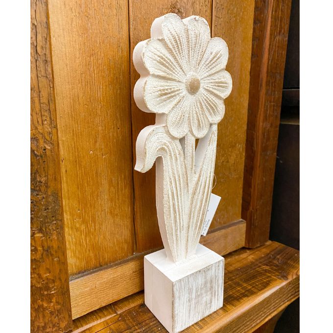 Carved wooden flower sculpture on a wooden surface. Whitewashed Wooden Flowers - Three Styles available at Quilted Cabin Home Decor.