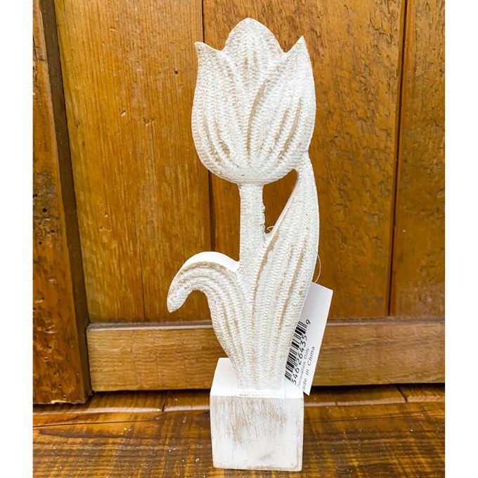 Decorative white tulip sculpture on a wooden block with a wooden panel background. Whitewashed Wooden Flowers - Three Styles available at Quilted Cabin Home Decor.