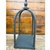 Decorative wood stand against a wooden background. Black Curved Top Lantern - Two Sizes available at Quilted Cabin Home Decor.