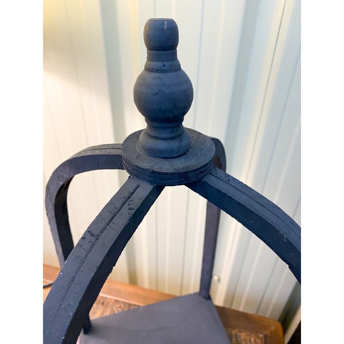 Close-up of a  black open lantern. Black Curved Top Lantern - Two Sizes available at Quilted Cabin Home Decor.