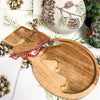 Wooden cheese board shaped as a snowman comes with a wooden handled knife. Available at Quilted Cabin Home Decor.