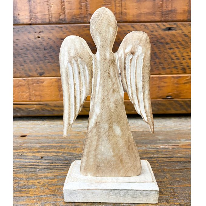 Wooden angel figurine on a wooden base with a rustic wooden background. Distressed White Wooden Angel available at Quilted Cabin Home Decor.