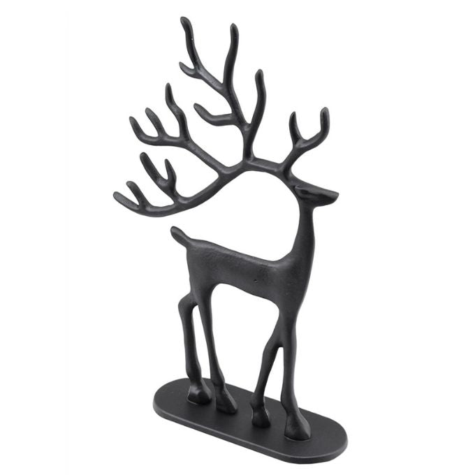 A matte black metal deer jewelry organizer shaped like a standing deer with antlers, mounted on a flat oval base, shown against a plain white background available at Quilted Cabin in Airdrie