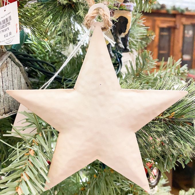 White Star Ornaments - Three Sizes are white hammered metal stars that hang from jute. Available at Quilted Cabin Home Decor.