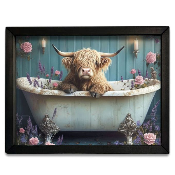 Framed artwork of a highland cow in a bathtub with flowers and candles. Highland Cow Pink & Purple Tub Box Frame available at Quilted Cabin Home Decor.
