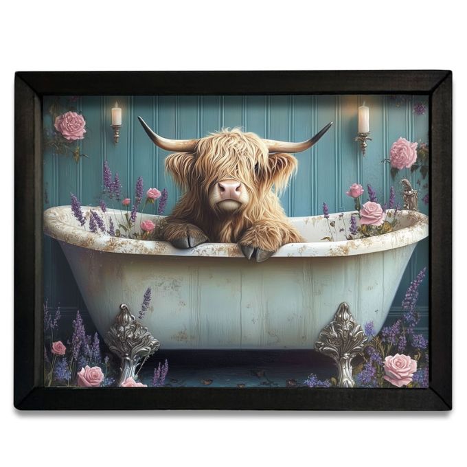Framed artwork of a highland cow in a bathtub with flowers and candles. Highland Cow Pink & Purple Tub Box Frame available at Quilted Cabin Home Decor.
