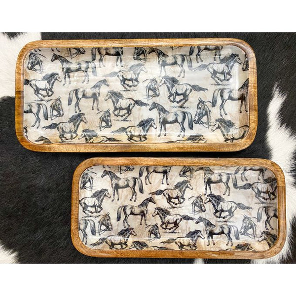 Two wooden trays with horse pattern on a black and white background. Enamel Horse Decorative Trays - Two Sizes available at Quilted Cabin Home Decor.