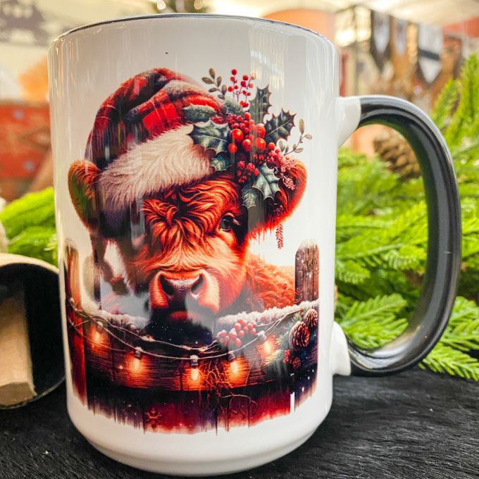 Highland Cow in Christmas Lights Mug available at Quilted Cabin Home Decor.