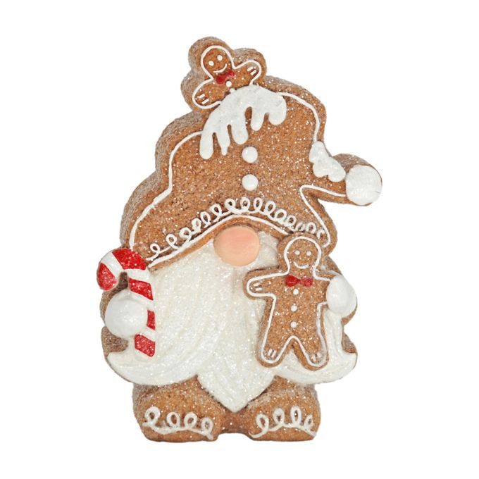 Gingerbread gnome figurine has a full beard and is holding a candy cane and gingerbread man. It is available at Quilted Cabin Home Decor.