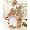 Gingerbread gnome figurine has a full beard and is holding a candy cane and gingerbread man. It is available at Quilted Cabin Home Decor.