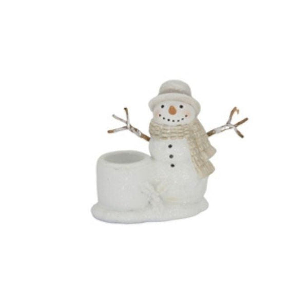 A small snowman taper holder in white with a beige hat, scarf, and twig arms.  Perfect for taper candles and available at Quilted Cabin in Airdrie