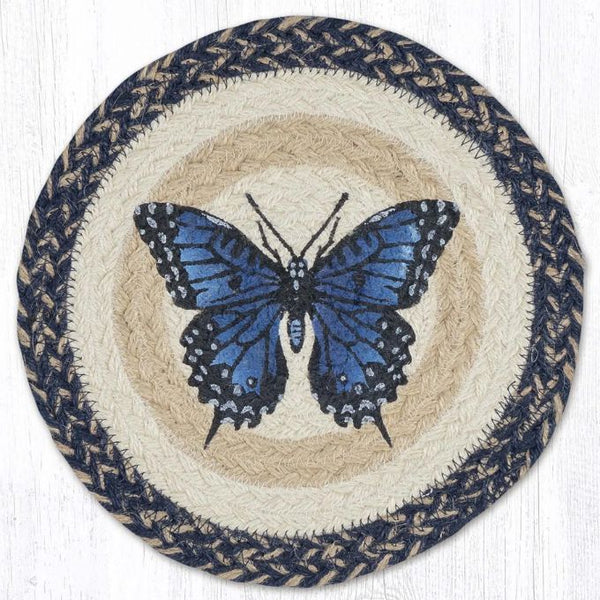 Round woven mat with a blue butterfly design on a white background. Blue Swallowtail braided trivet at Quilted Cabin Home Decor.