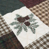 Quilted fabric with embroidered pinecones and branches on a patchwork background. Pine Panels King Quilt Set available at Quilted Cabin Home Decor.
